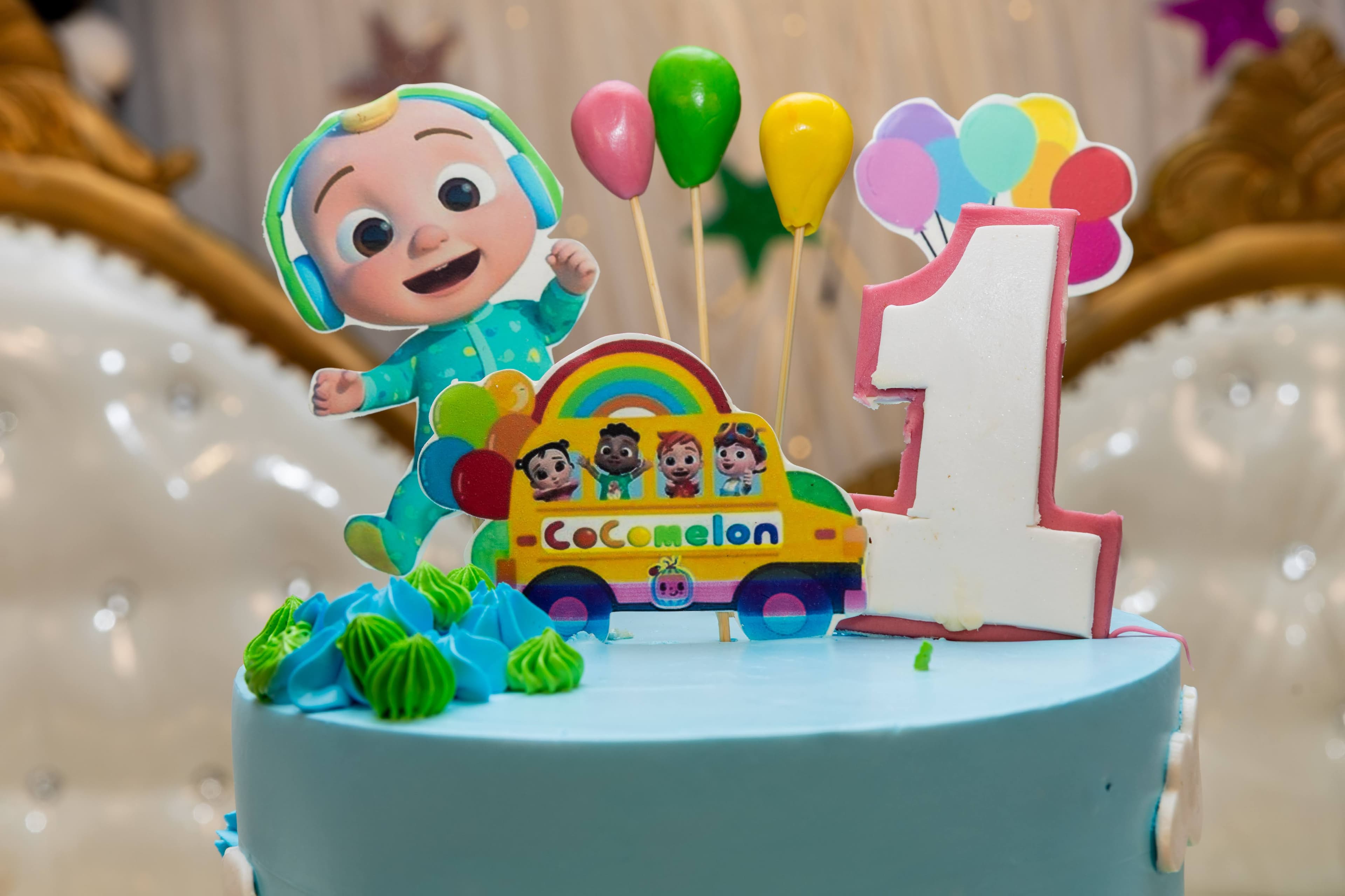 Cocomelon themed first birthday with character cake