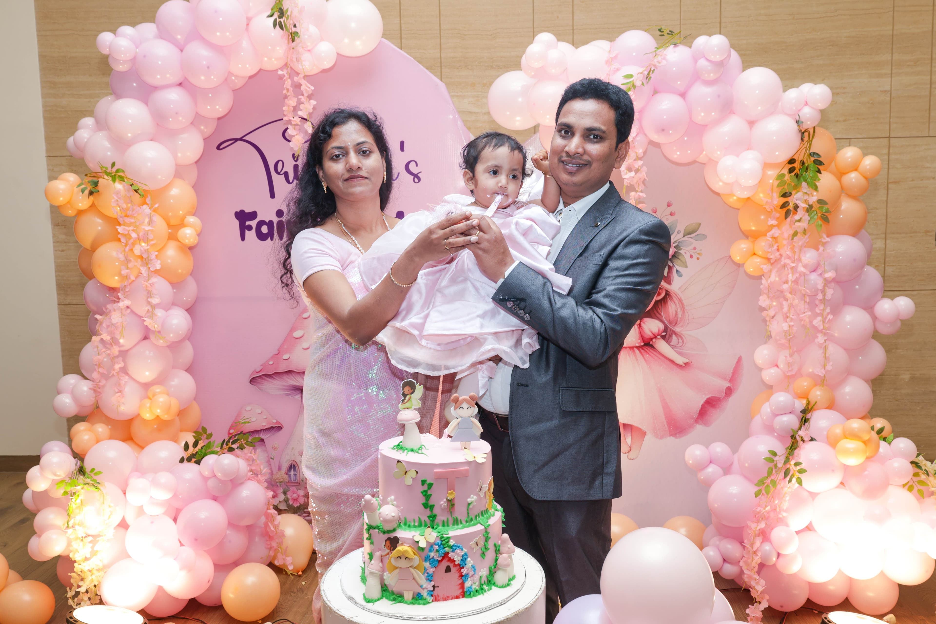 Family portrait at fairy princess themed first birthday